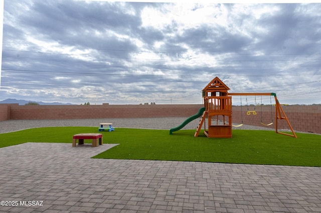 view of playground featuring a lawn