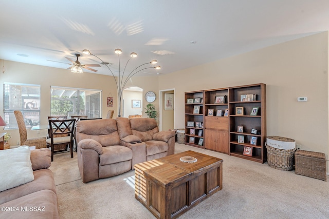 carpeted living room featuring ceiling fan