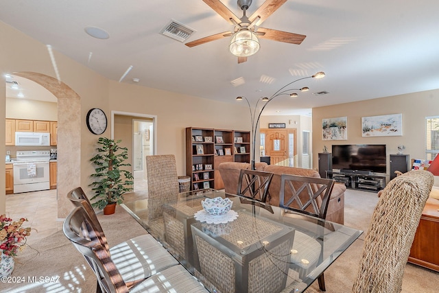 dining space with ceiling fan and light tile patterned flooring