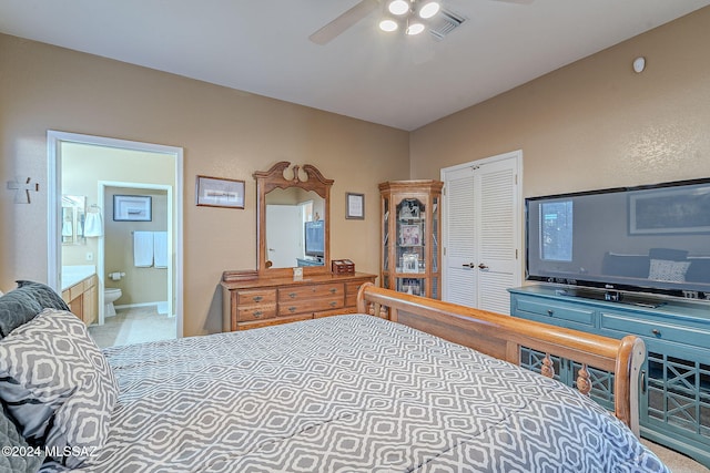 bedroom with connected bathroom, ceiling fan, a closet, and carpet floors