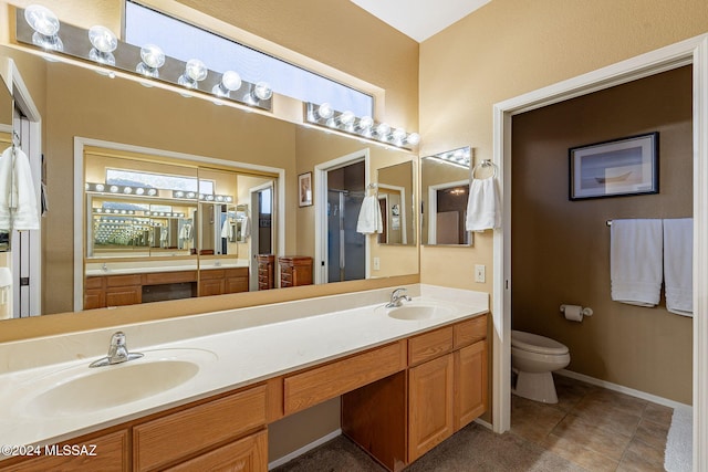 bathroom featuring tile patterned floors, vanity, and toilet