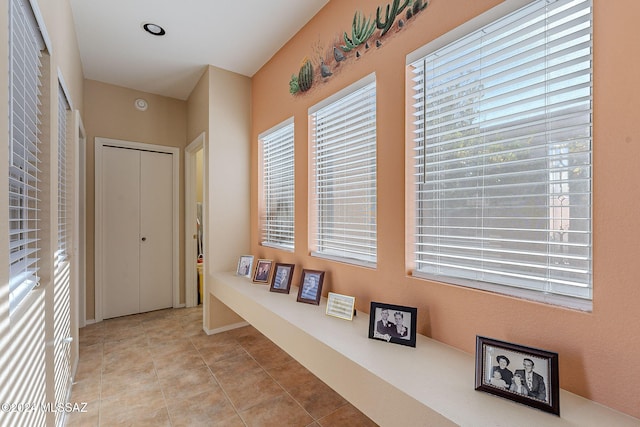 corridor featuring light tile patterned flooring