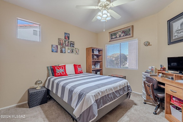 bedroom with light carpet and ceiling fan