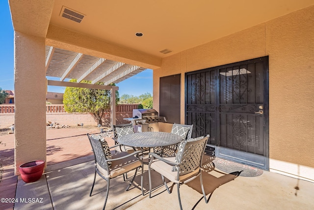 view of patio with a pergola and a grill