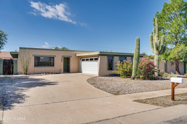 ranch-style house featuring a garage