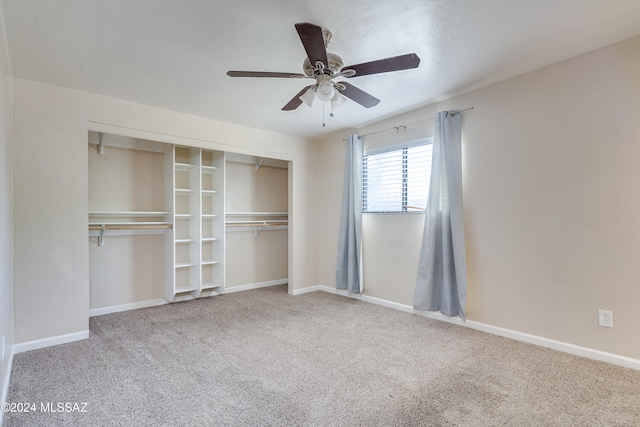 unfurnished bedroom featuring carpet flooring, ceiling fan, and a closet