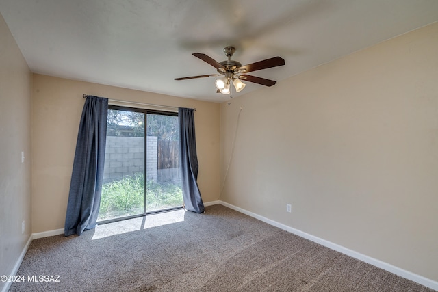 spare room featuring carpet flooring and ceiling fan