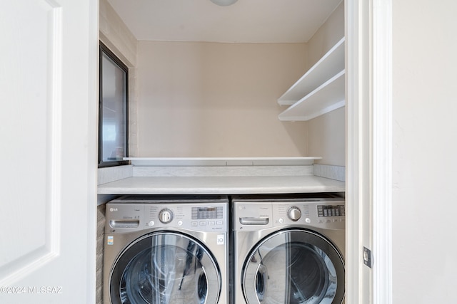 laundry area featuring washing machine and dryer