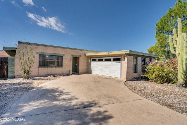 ranch-style home with a garage