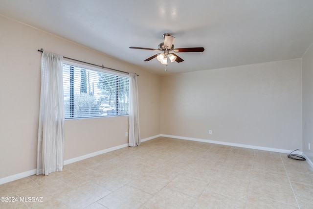 spare room with ceiling fan