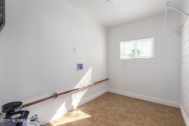 washroom with tile patterned floors and washer hookup