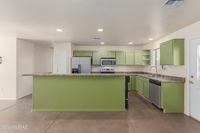 kitchen with a center island, concrete flooring, sink, and appliances with stainless steel finishes