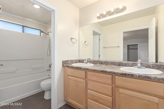 full bathroom with tile patterned flooring, shower / tub combination, vanity, and toilet