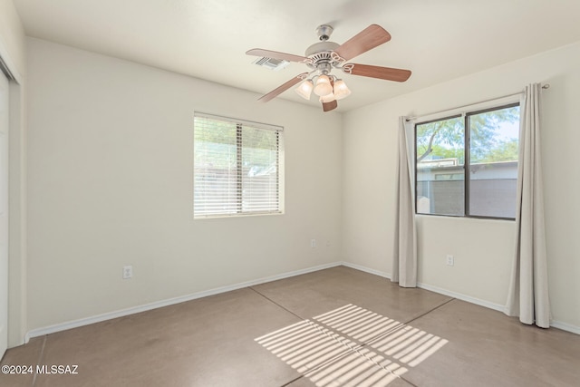 unfurnished bedroom featuring multiple windows and ceiling fan