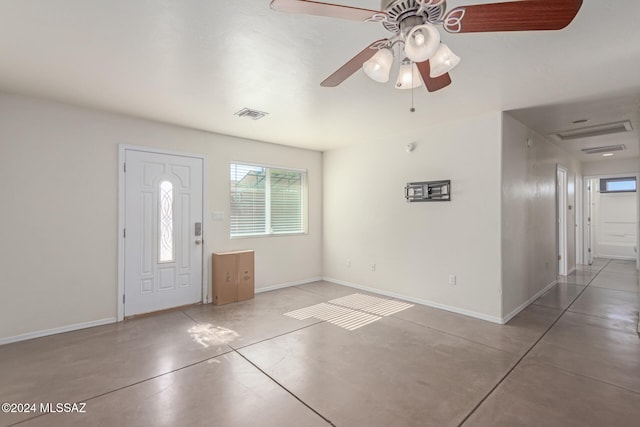 foyer featuring concrete flooring and ceiling fan