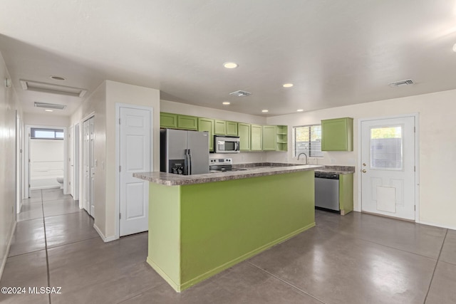 kitchen featuring sink, a kitchen island, and appliances with stainless steel finishes