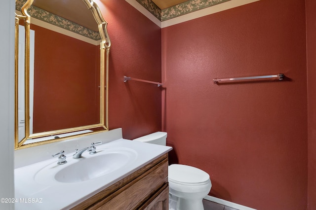 bathroom with vanity and toilet