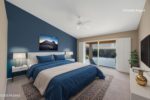 carpeted bedroom with access to outside, vaulted ceiling, and ceiling fan