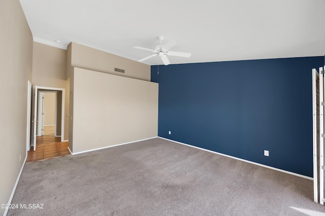 interior space with ceiling fan and carpet floors