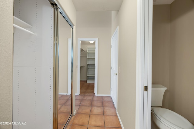 hallway featuring light tile patterned floors