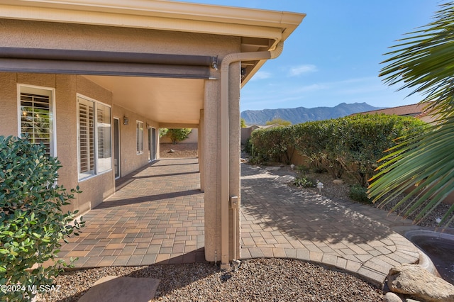 view of patio / terrace featuring a mountain view