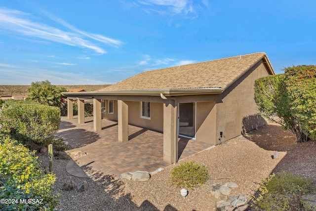 back of property with a patio area