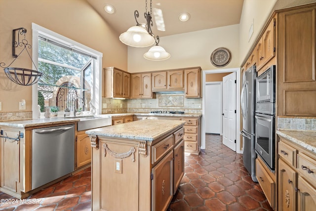 kitchen with a kitchen island, appliances with stainless steel finishes, pendant lighting, sink, and backsplash