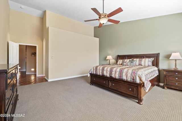 carpeted bedroom with ceiling fan