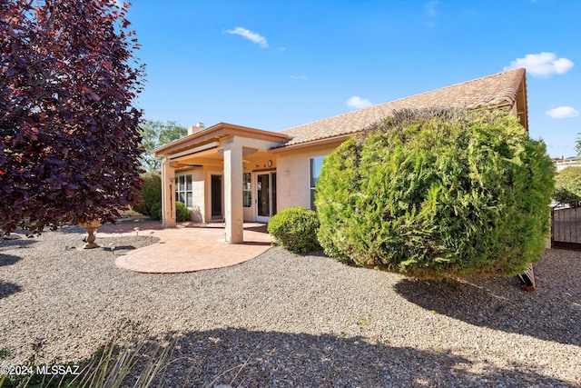 back of house featuring a patio