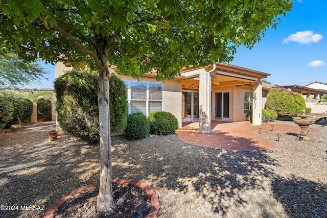 back of house featuring a patio