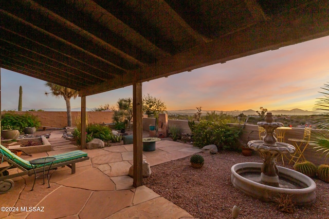 view of patio terrace at dusk