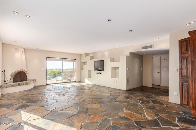 unfurnished living room with a fireplace