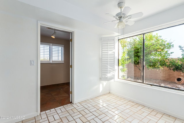 unfurnished room with ceiling fan