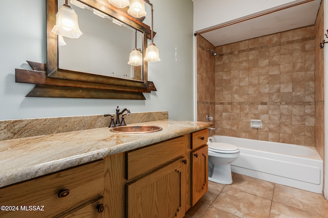 full bathroom with vanity, tiled shower / bath combo, toilet, and tile patterned flooring