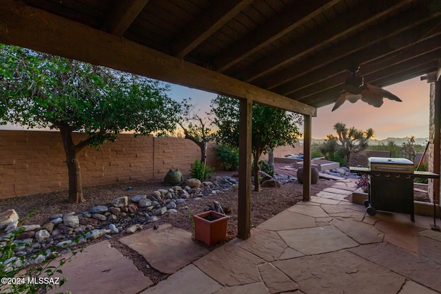 patio terrace at dusk with area for grilling