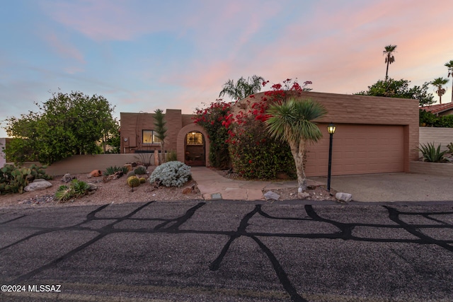 view of front of home with a garage