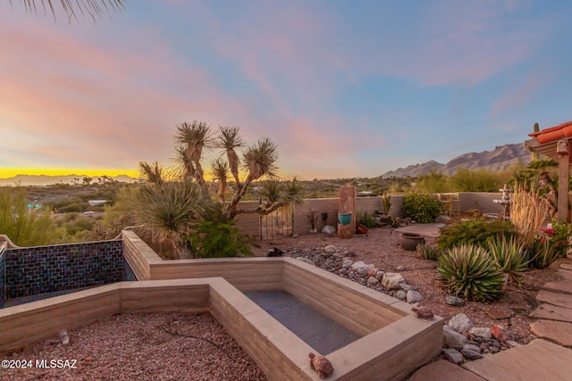 patio terrace at dusk with a mountain view