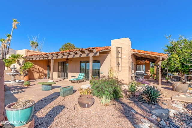 back of property featuring a patio