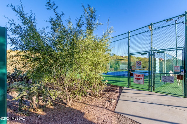 exterior space featuring tennis court