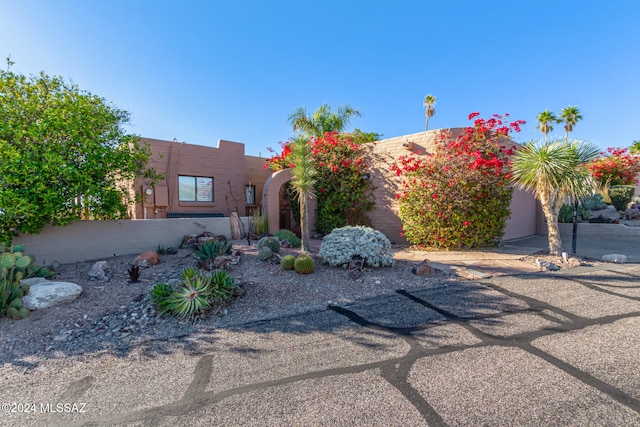 adobe home featuring a garage