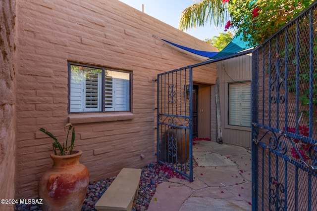 doorway to property with a patio