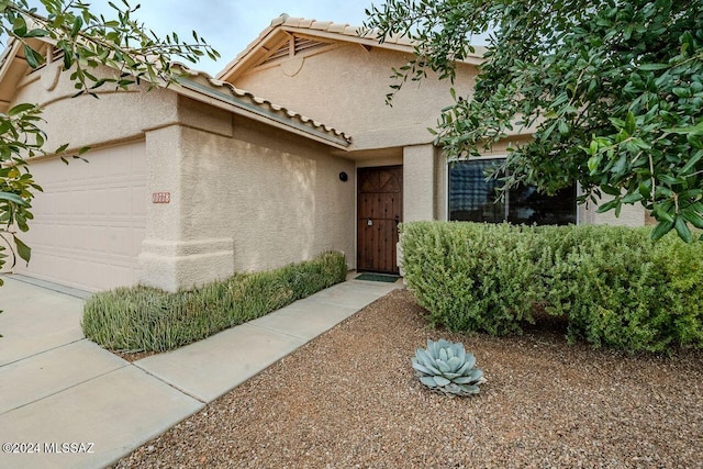 view of front of property with a garage