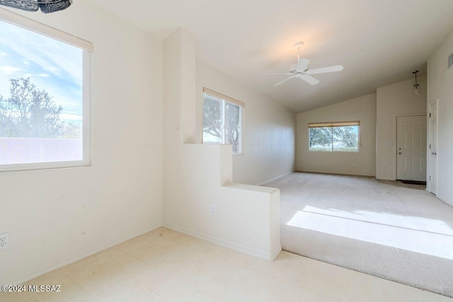 interior space with ceiling fan and vaulted ceiling