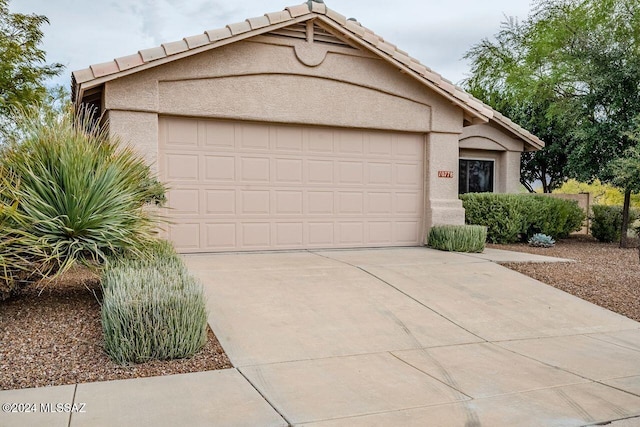 view of front of home with a garage