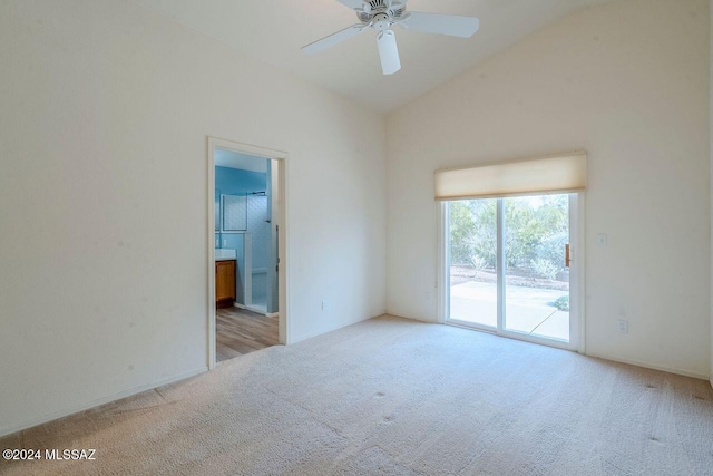 unfurnished room with light carpet, vaulted ceiling, and ceiling fan