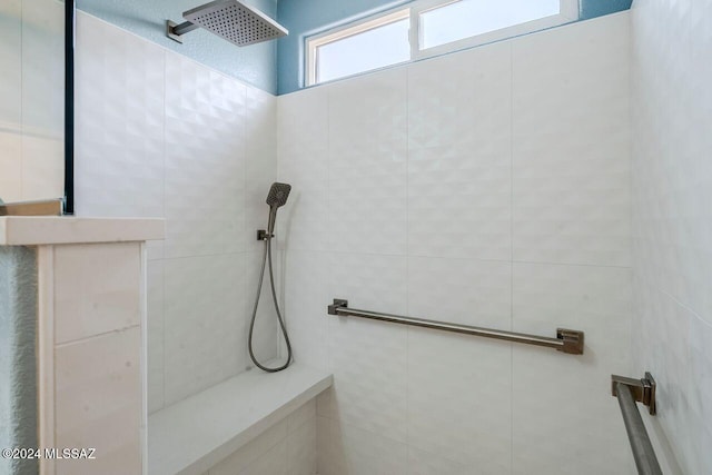 bathroom with tiled shower