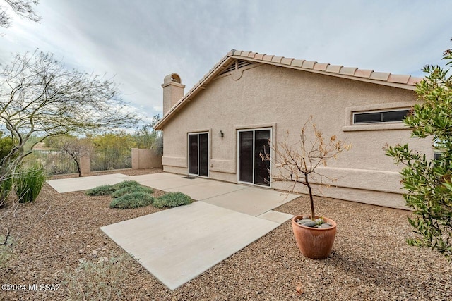 rear view of property with a patio