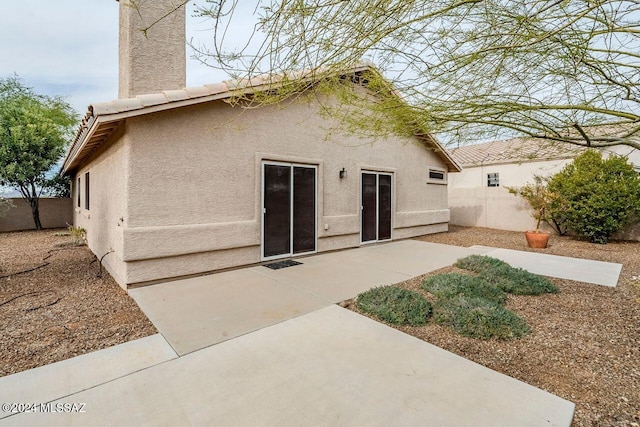 back of property featuring a patio