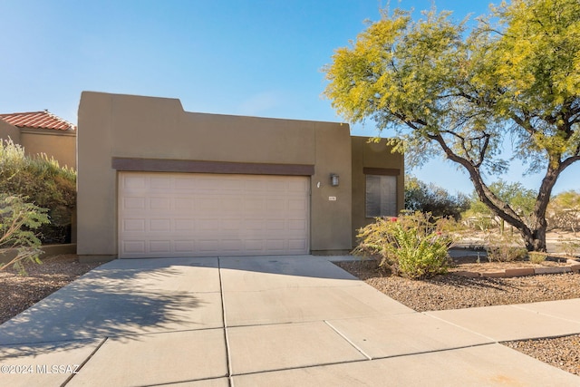 adobe home featuring a garage