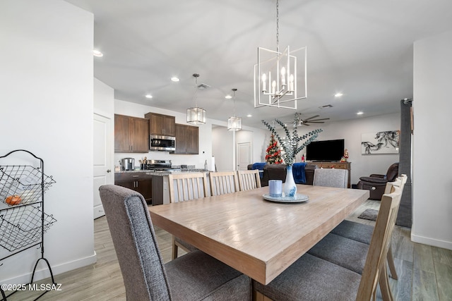 dining space featuring ceiling fan and light hardwood / wood-style floors